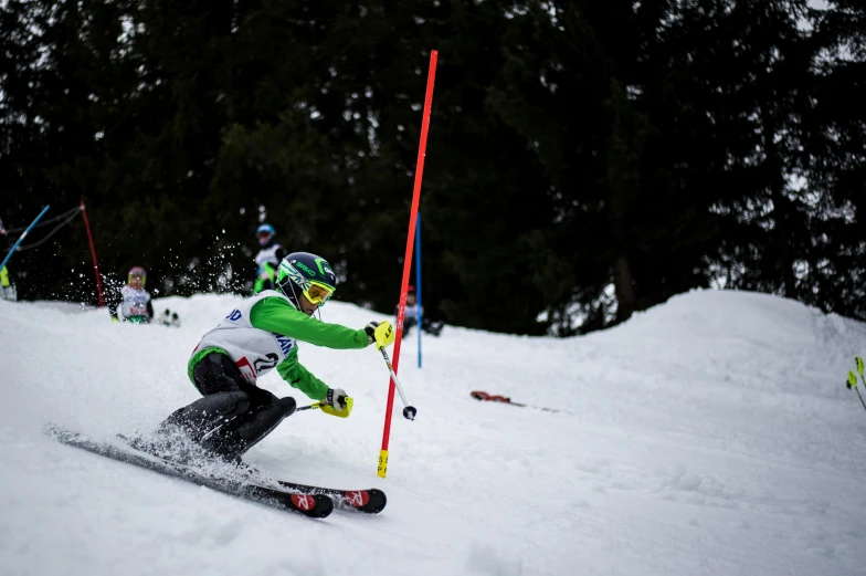 a skier makes a turn while skis down the slope