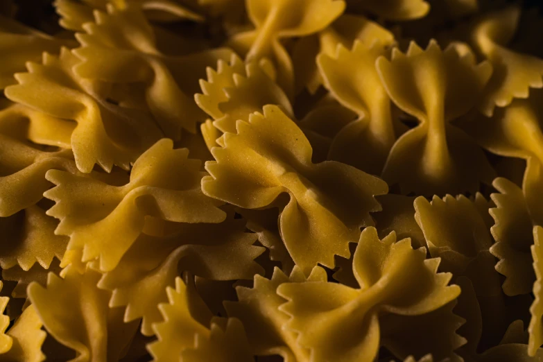 yellow pasta is arranged on the counter