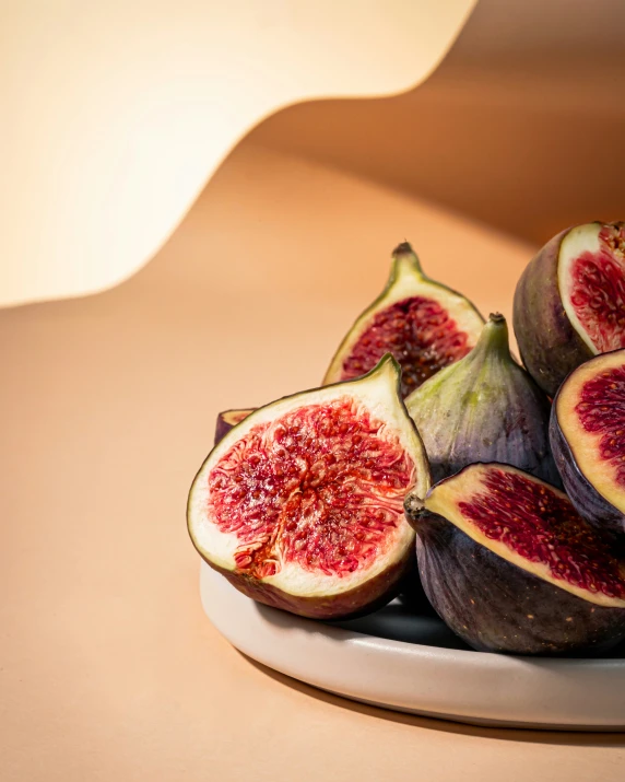 figs cut up and sitting on a plate