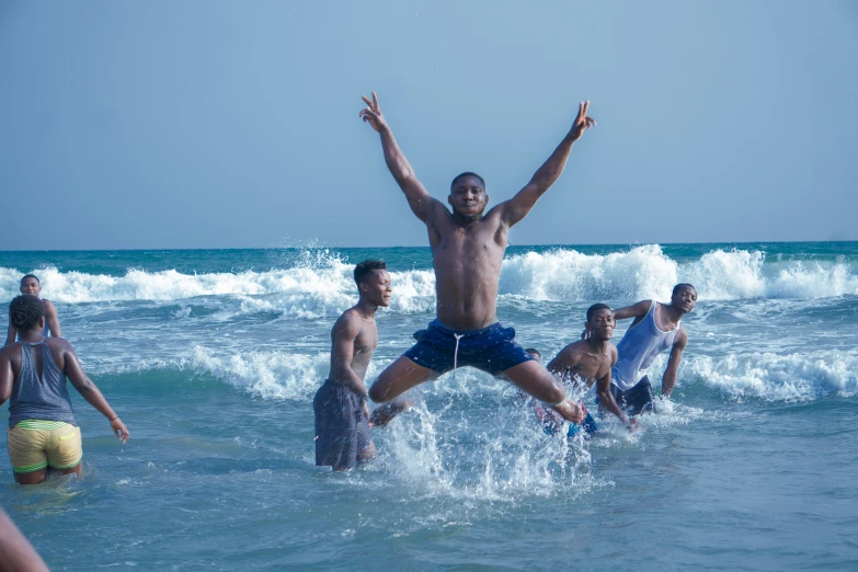 the people are in the water near the surf