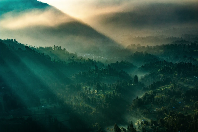 fog is rolling over the green hills