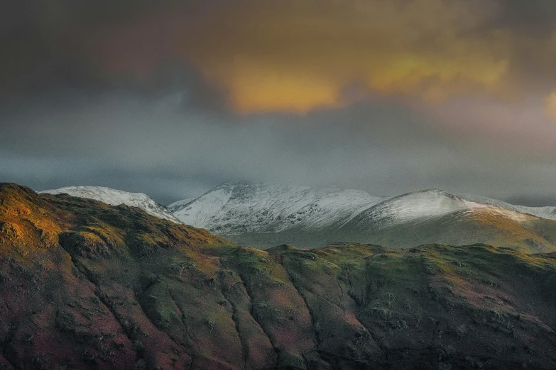 a mountain with some snow on it