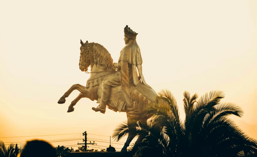 a large statue sitting on the top of a horse