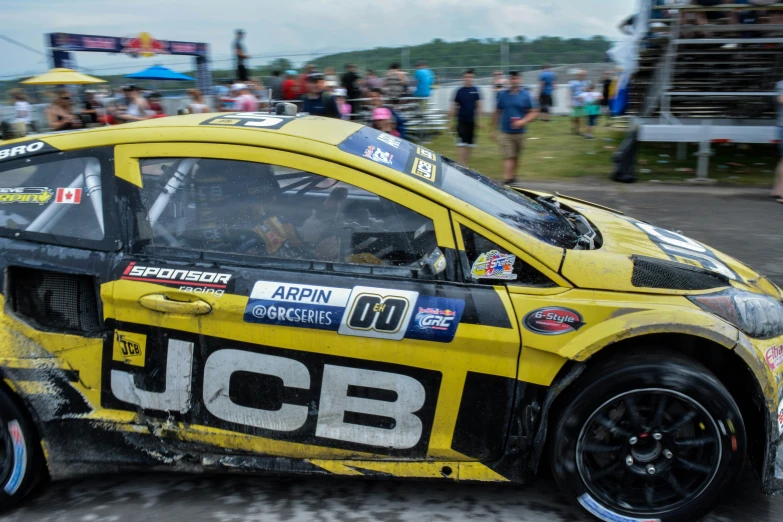 a yellow racing car at a race track