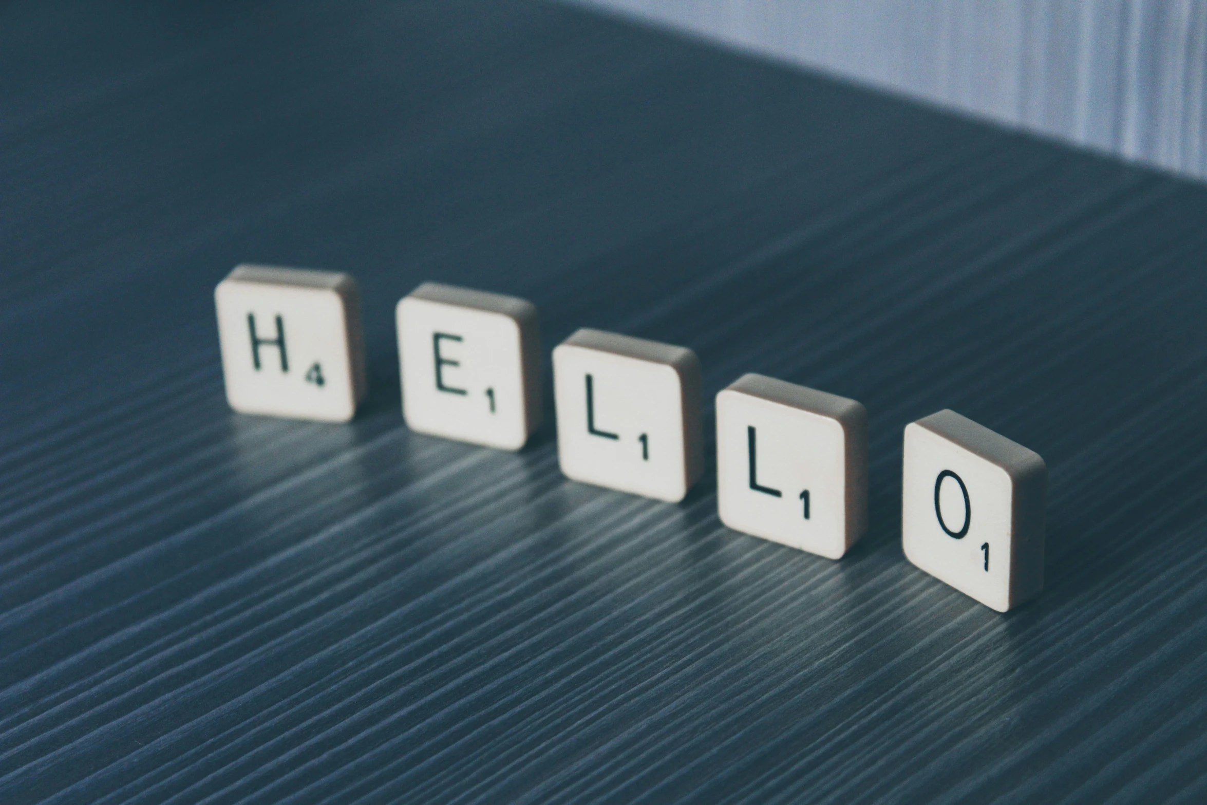 cubes with words spelling out a word hello