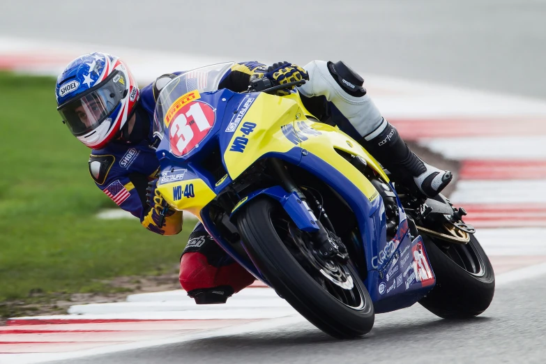 a person on a racing motorcycle on a track