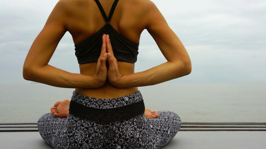 a woman that is in the middle of a yoga pose