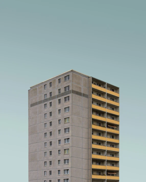 a very tall building with windows on one side and balconies on the other