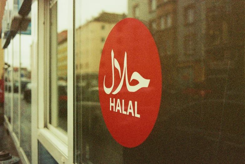 a red sign mounted to the side of a window