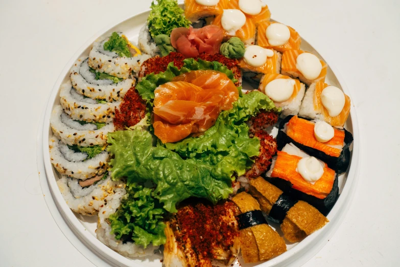 an assortment of different sushi on a plate