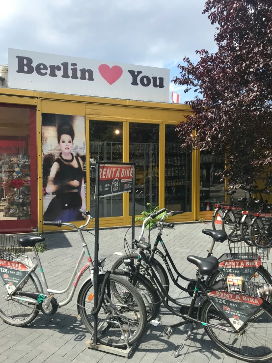 several bicycles parked in front of a store