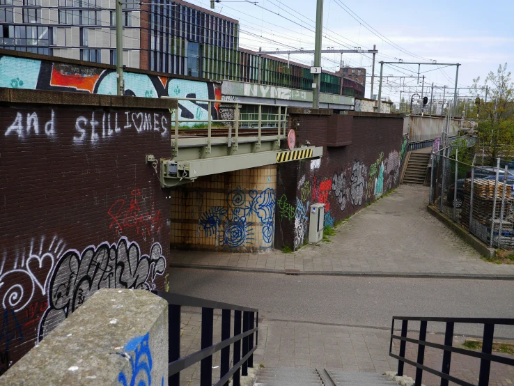 graffiti is all over the walls on a brick building