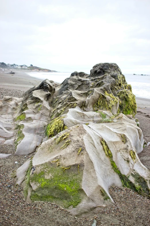 a large rock with a few rocks under it