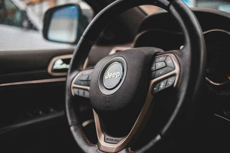 the dashboard inside of a vehicle, including the steering wheel and dash board