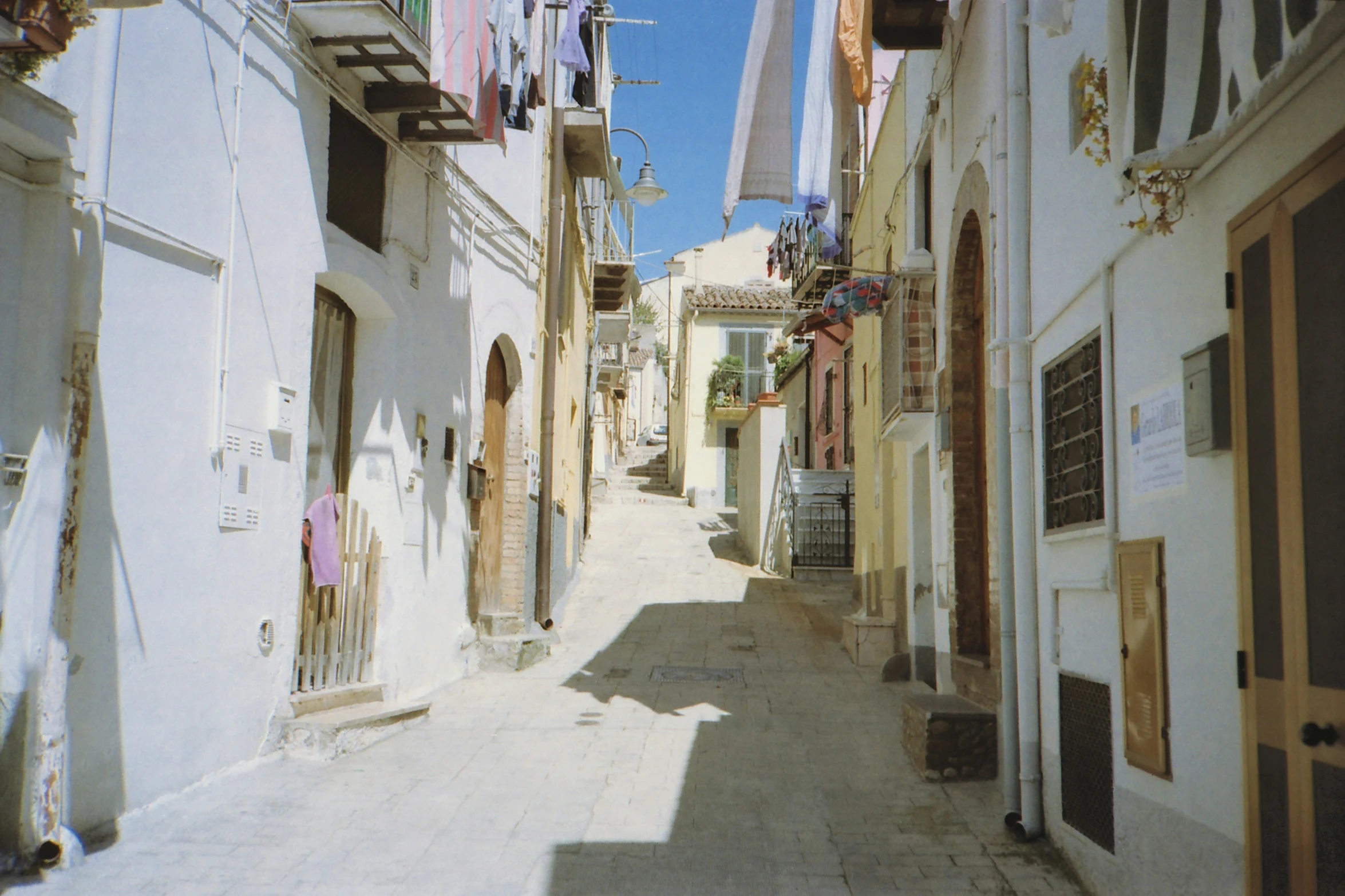 a narrow white street is shown in this image