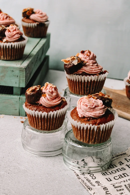 a table that has some cupcakes on top of it