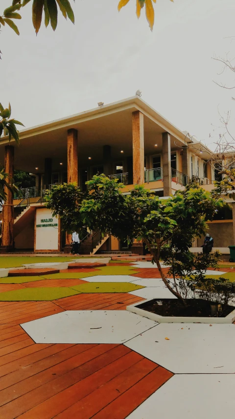 a white house with an orange planter near it