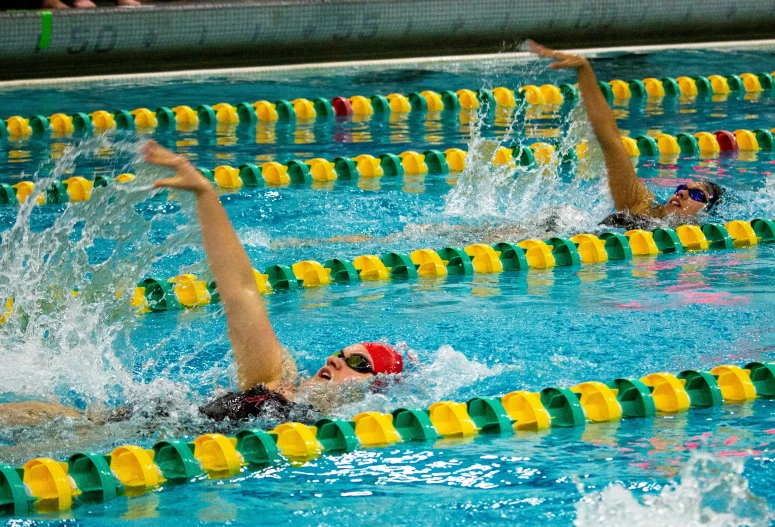 some s swimming in a swimming pool