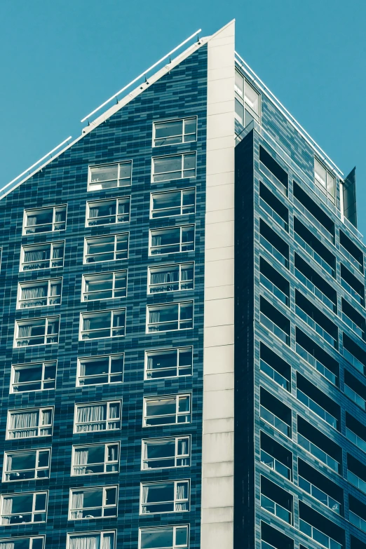 a very tall building next to other buildings