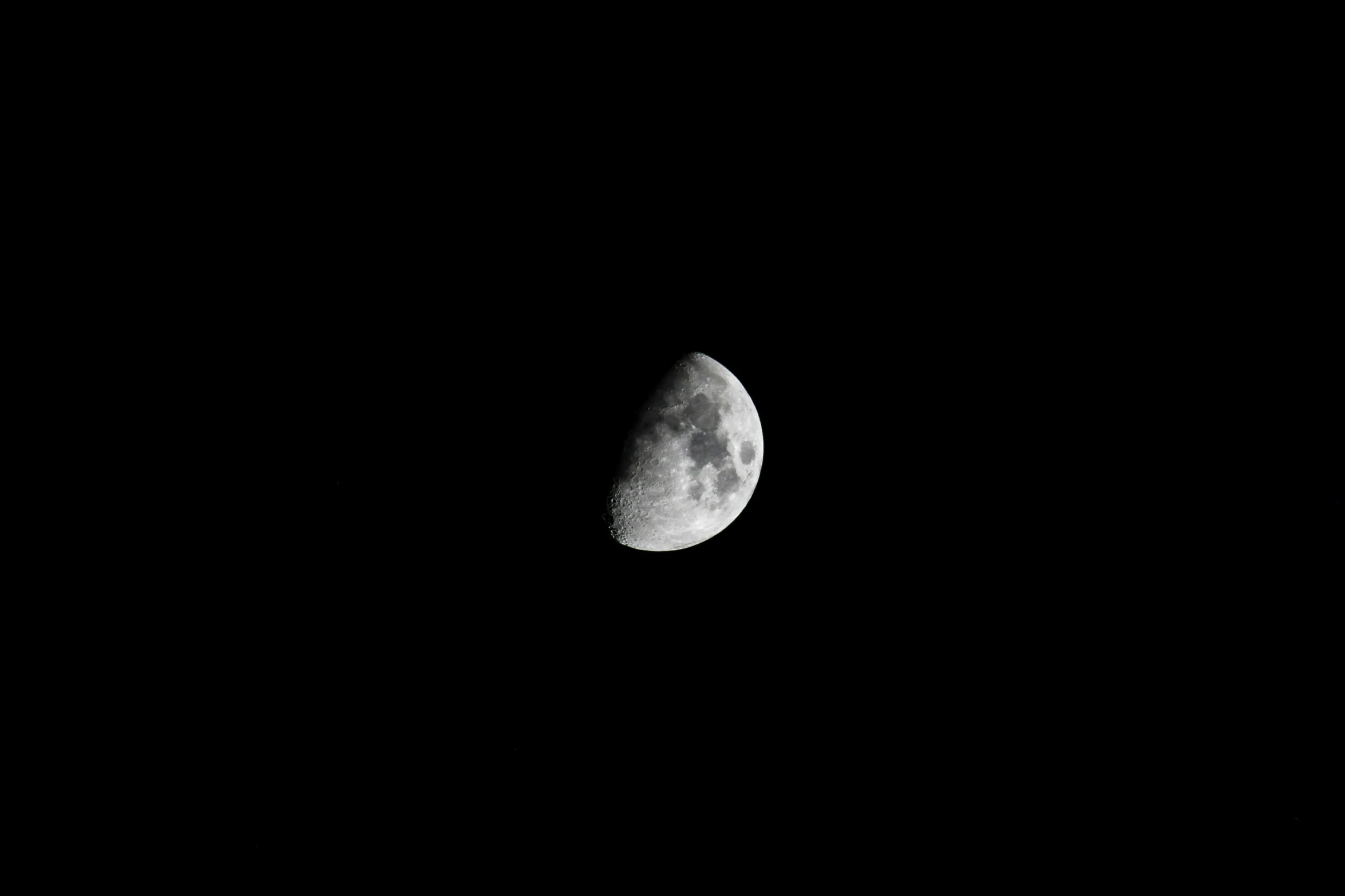 the moon in a black night sky