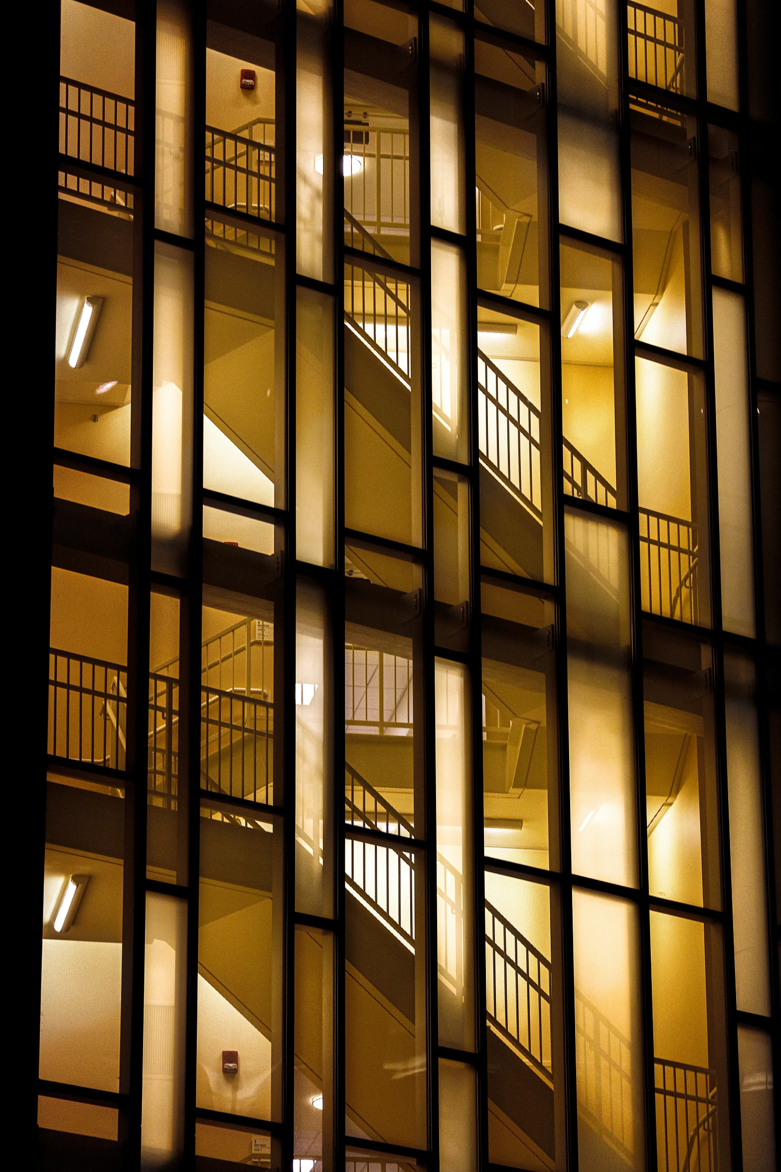 this is a building at night with many windows