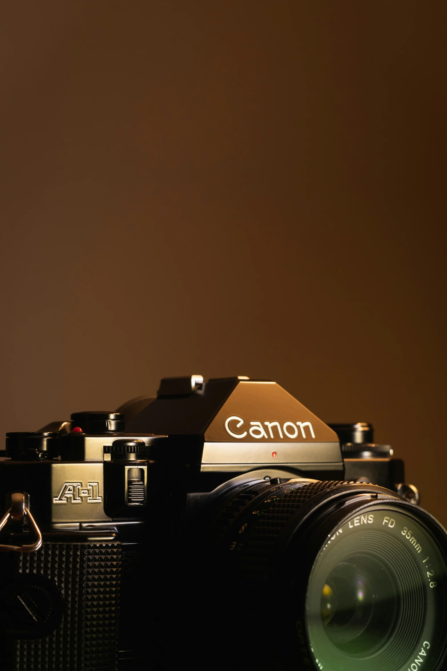 a vintage camera sitting on a table with the lens pointing at it