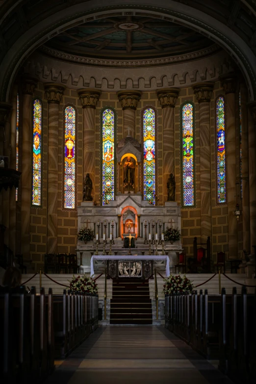 inside of an old church with the pews still open