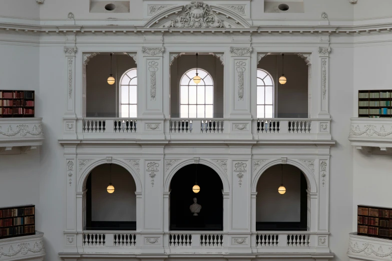 an inside s of a white building with many windows