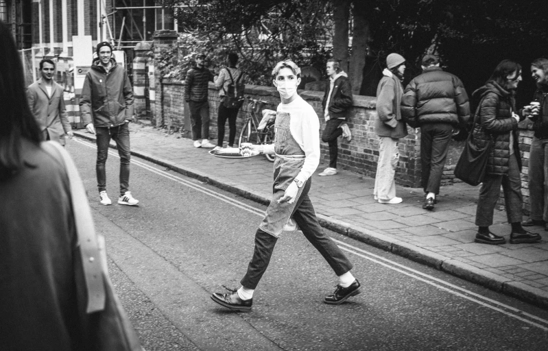 a man walking in the middle of a crowd