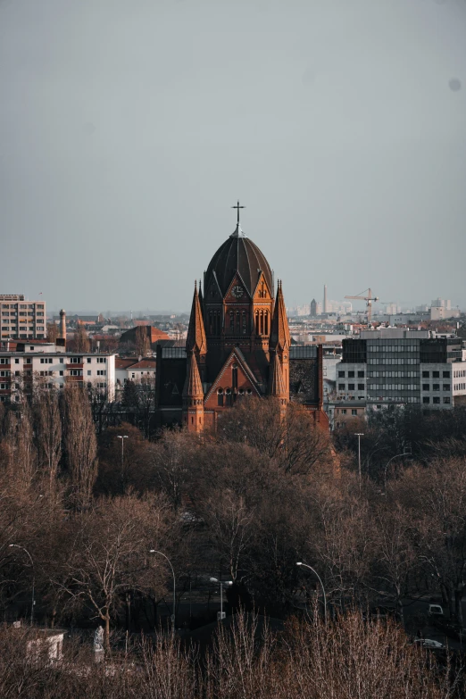 large old church towers over a city landscape