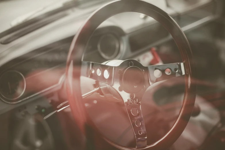 a view from behind a vehicle steering wheel