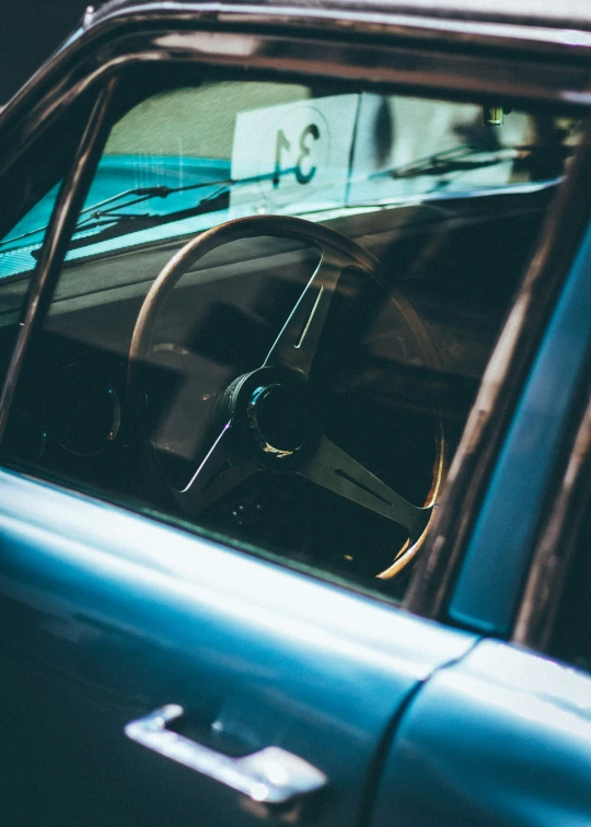 a view from the front seat of a car that has a clock in it