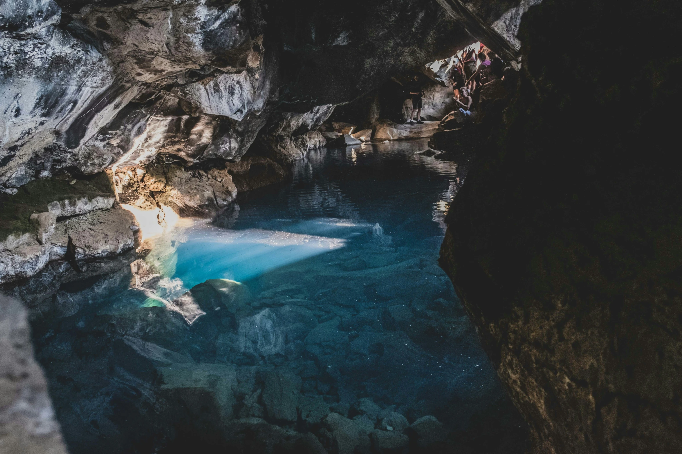 a cave filled with water that is partially submerged