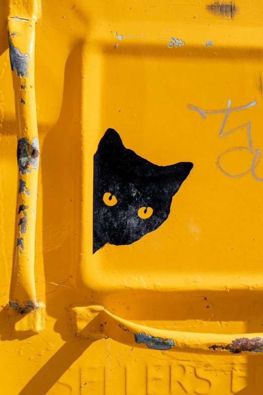 there is an image of a cat on the back of this vehicle