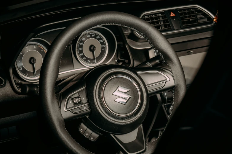 an inside view of the wheel and dashboard of a car