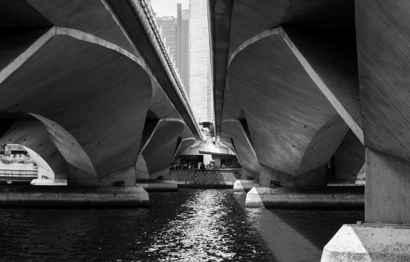 a black and white po of the underside of a bridge