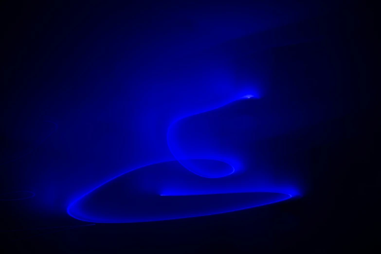 a light painting with blue colors and light on black background