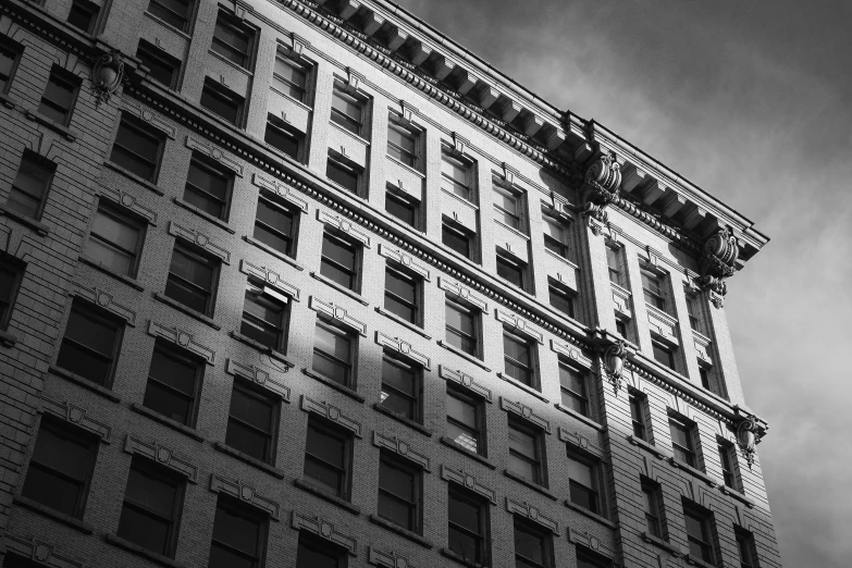 the building has many windows, one in a square shape