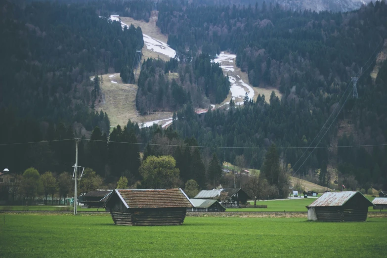 a rural valley that has a few small cabins in it