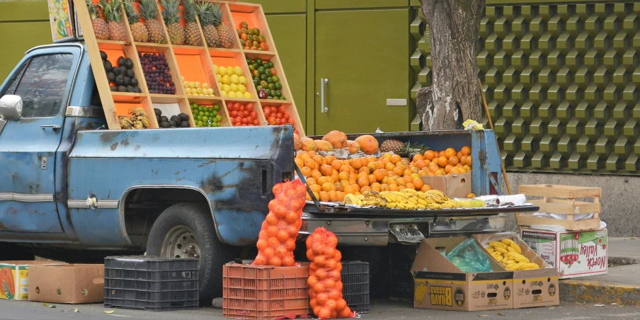 a truck with lots of fruits in the back