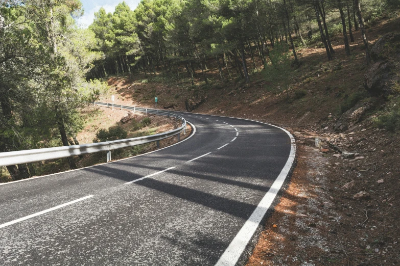 a winding highway with curve in the road