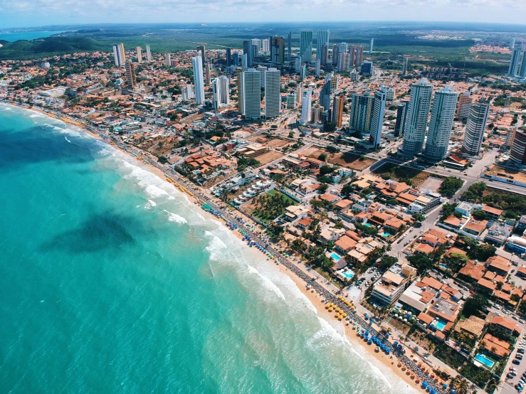 a beach with many buildings and a few blue waters