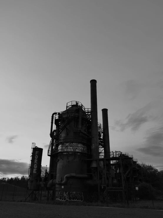 a black and white pograph of some large pipes