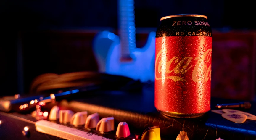 a can of beer on top of a mixer