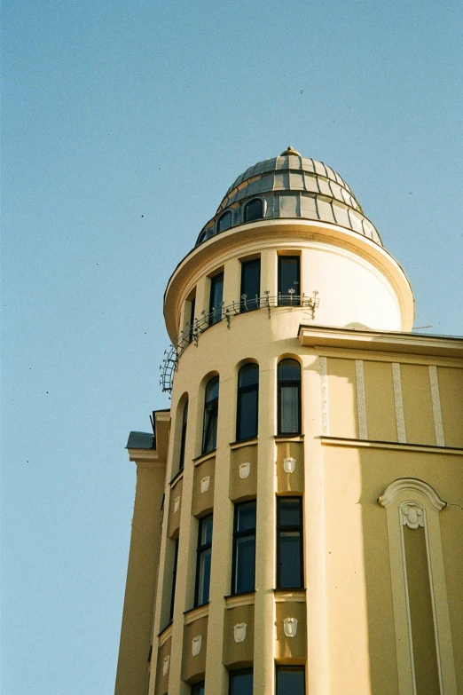 looking up at an elegant building with round top