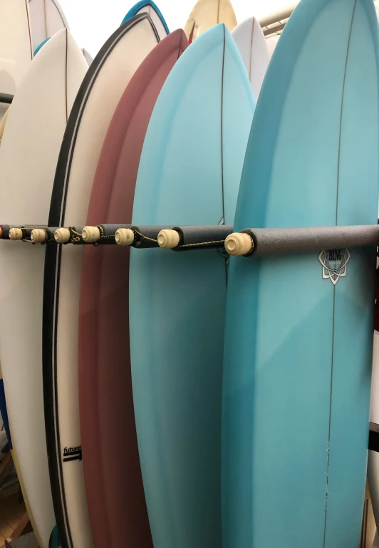 four surf boards with sticks sticking out of them