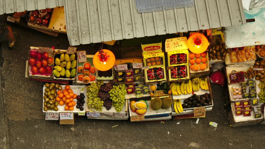 an assortment of fruit sitting at a stand