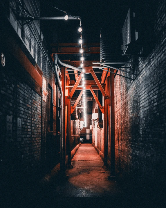 a dark alley way with the lights on