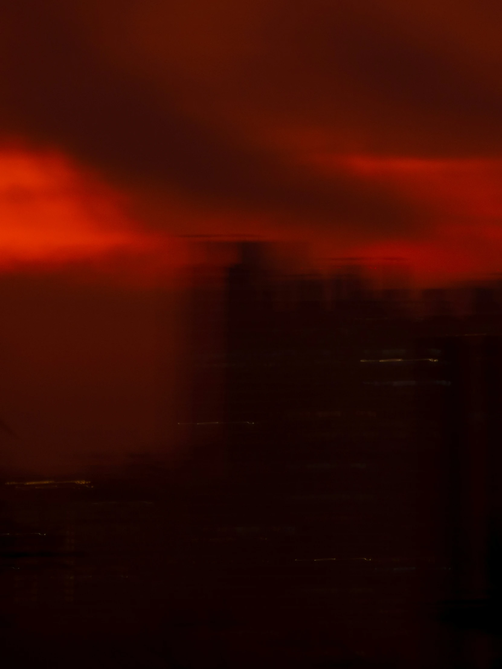 some very pretty dark colored clouds in a big city