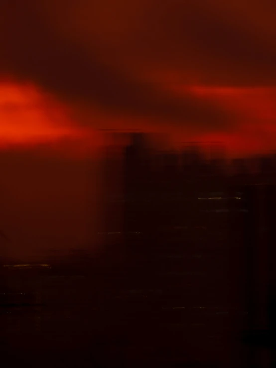 some very pretty dark colored clouds in a big city